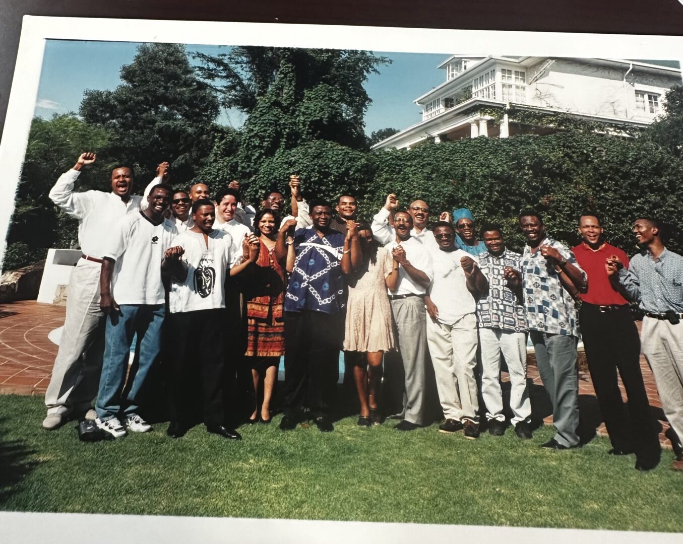 A group of people standing in front of a building.