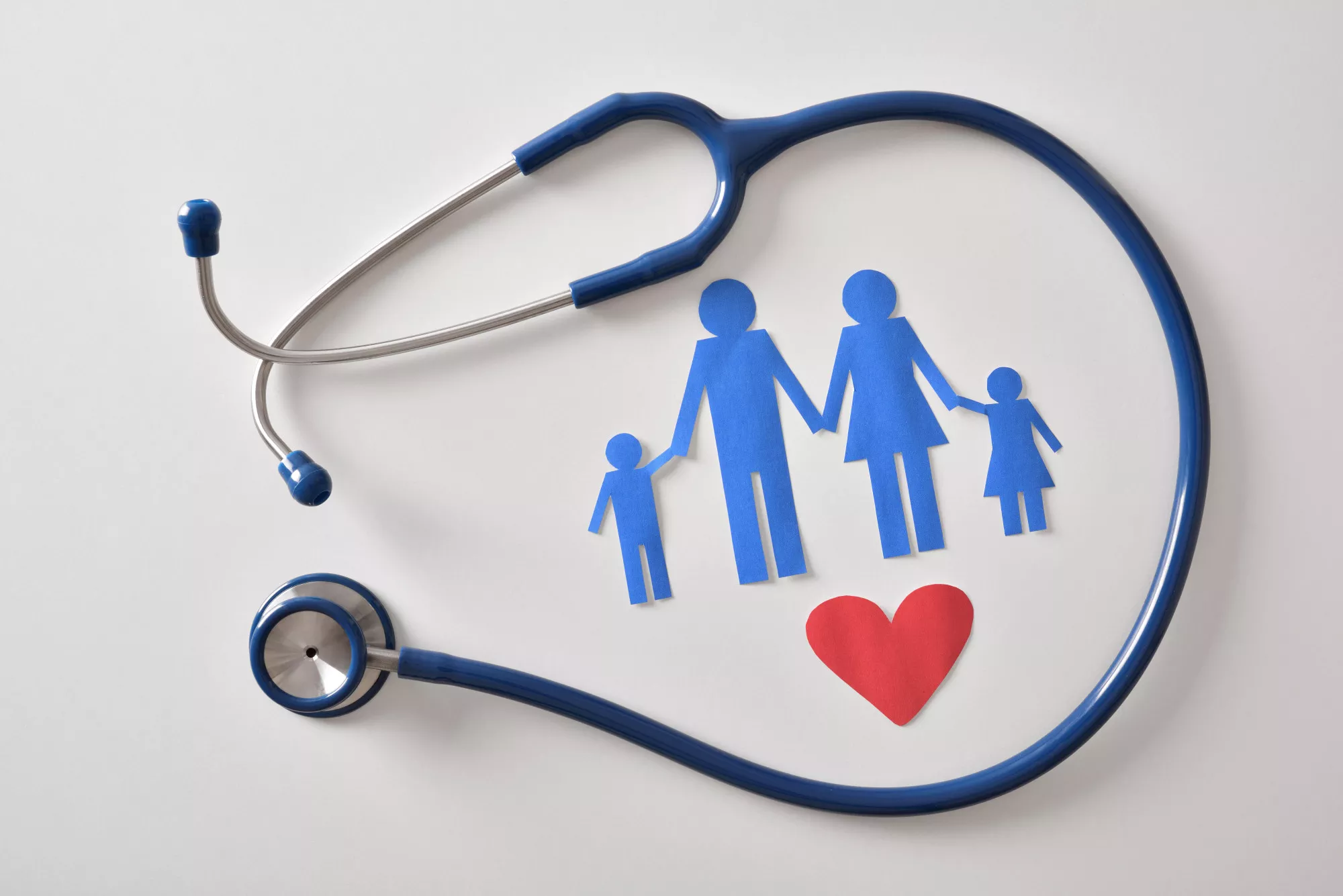 A stethoscope and paper cut out of family