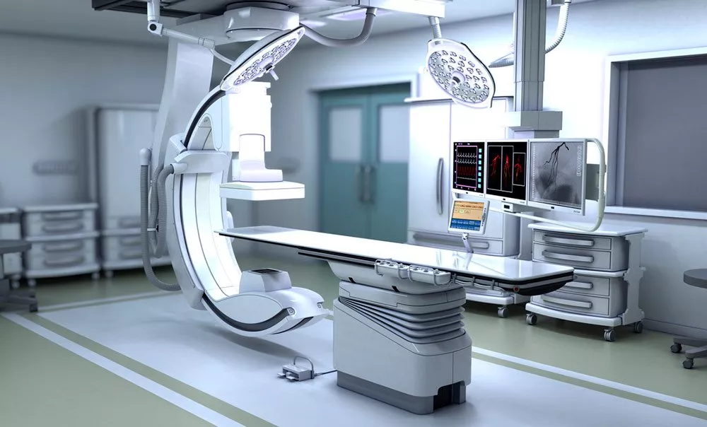 A hospital room with a large operating table.