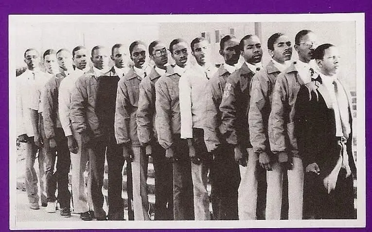 A black and white photo of men in uniforms.
