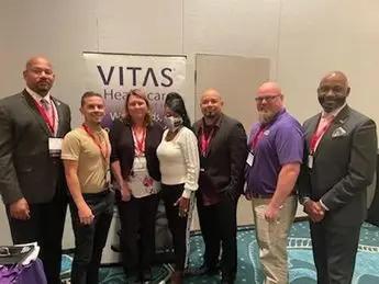 A group of people standing next to each other.
