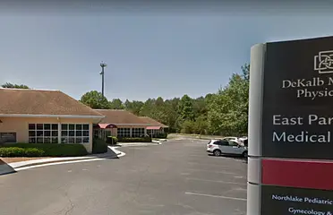 A parking lot with cars parked in it