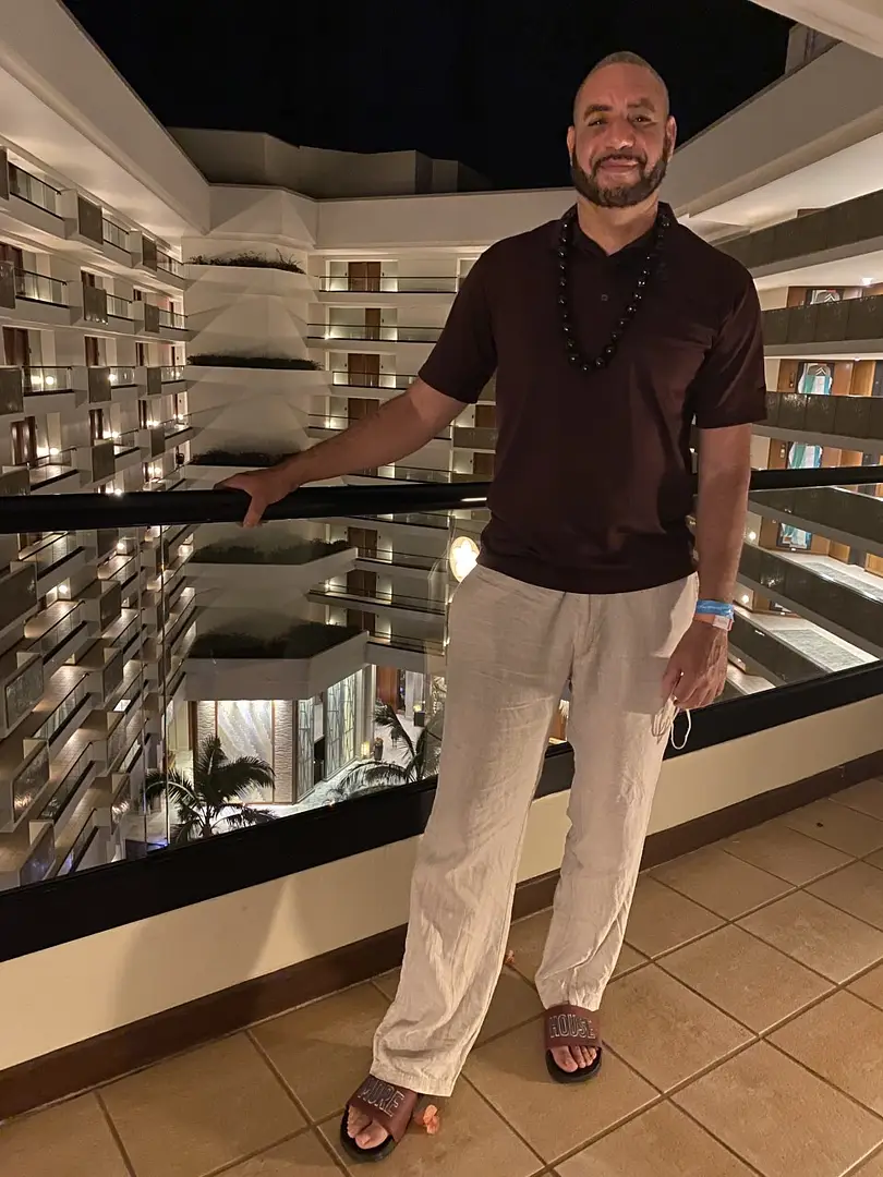 A man standing in front of a building.