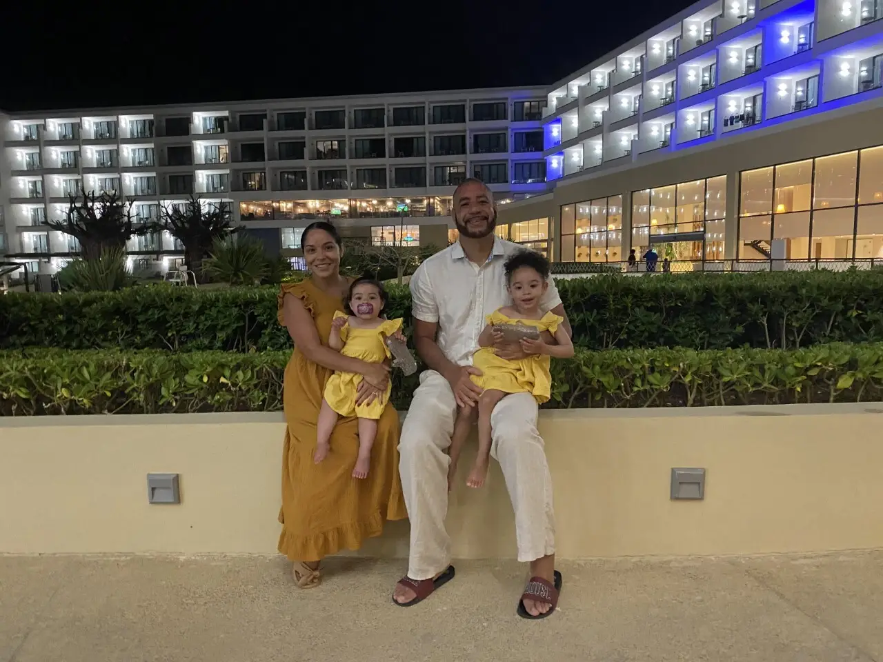 A man and two children posing for the camera.