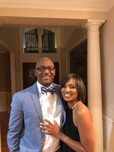 A man and woman posing for a picture.