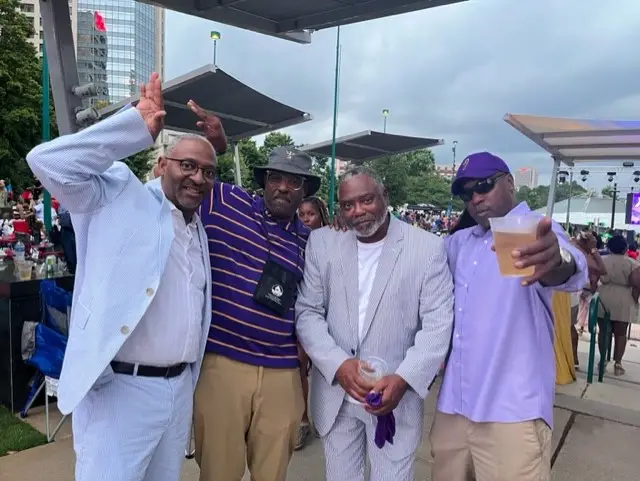 A group of men standing next to each other.
