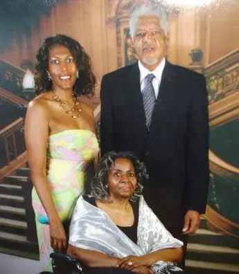 A family photo of two women and an older man.