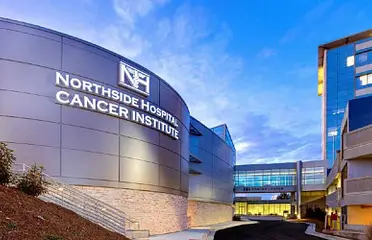 A large building with the words northside hospital cancer institute on it.