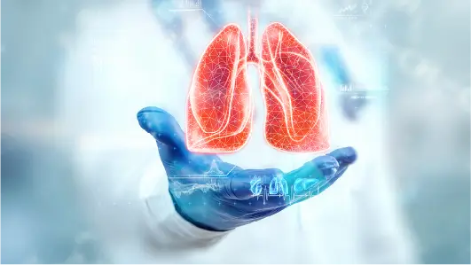 A hand with the image of lungs in front of it.