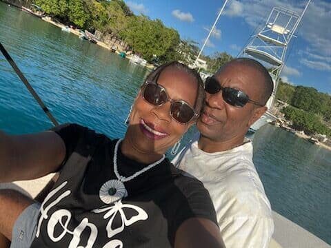 A man and woman taking a selfie on the boat.