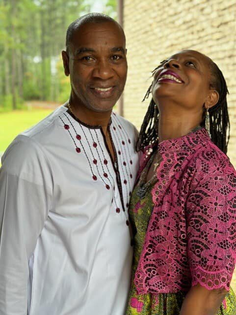 A man and woman posing for the camera.